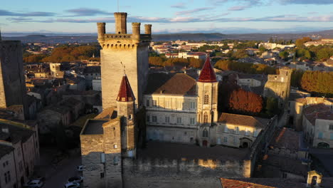 Uzes-France-aerial-sunrise-over-the-Duchy-of-Uzès-castle-close-up-shot